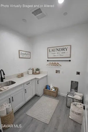 a spacious bathroom with double vanity sink and mirror