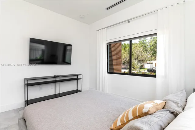 a bathroom with a sink toilet and a mirror