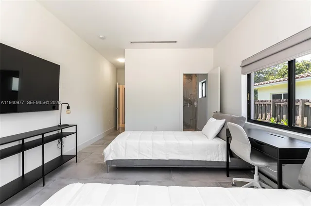 a view of swimming pool with outdoor seating and plants