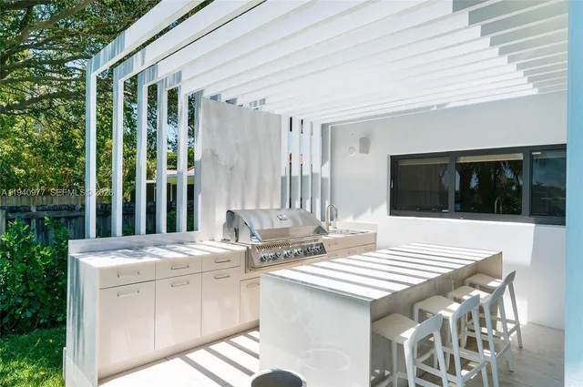 a front view of a house with a yard table and chairs