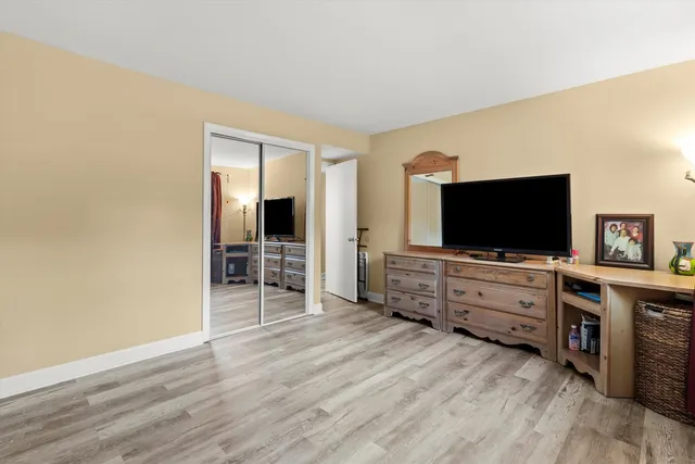 a room with furniture and flat screen tv