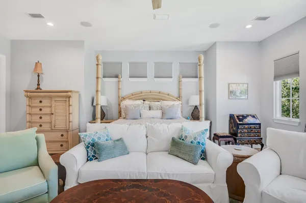 a bedroom with furniture and windows