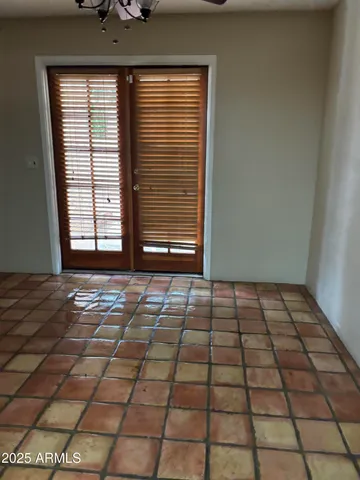 a close view of a stove a microwave and window in a room