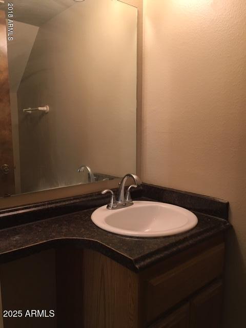 10424 North 11th Place, Unit 2 Phoenix, AZ 85020 - Photo 13 of 41 a bathroom with a sink and a mirror
