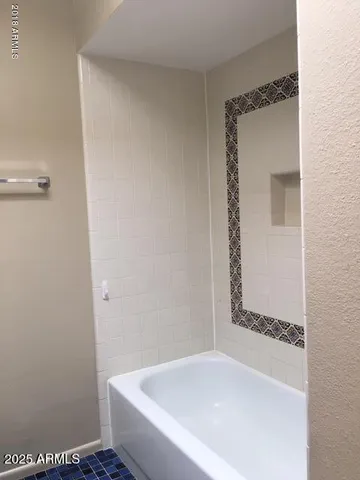 a bathroom with a bathtub