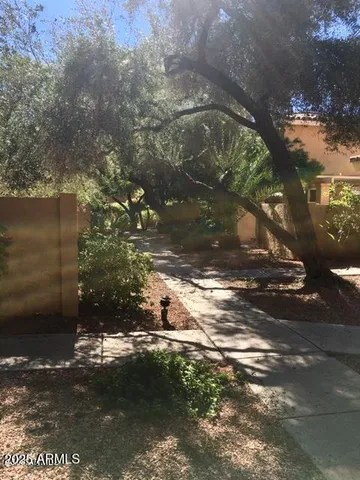 a view of a house with a tree