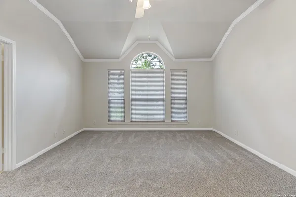 an empty room with a empty space and windows