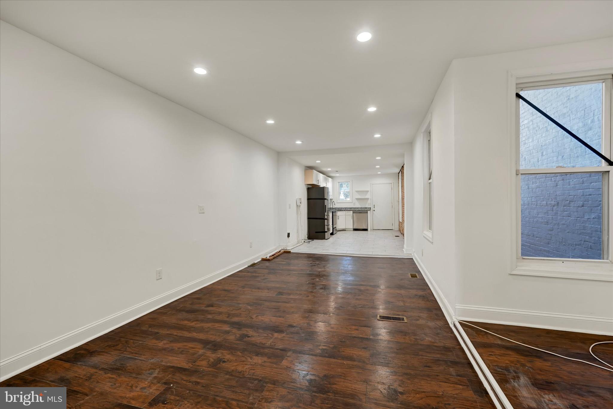 346 East 25th Street Baltimore, MD 21218 - Photo 12 of 31 a view of a hallway with wooden floor