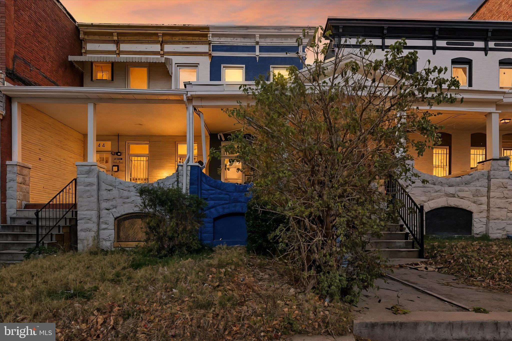 346 East 25th Street Baltimore, MD 21218 - Photo 4 of 31 front view of a house with a small yard