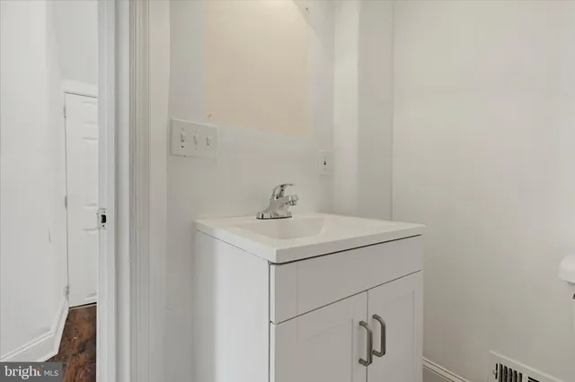 a bathroom with a sink and mirror