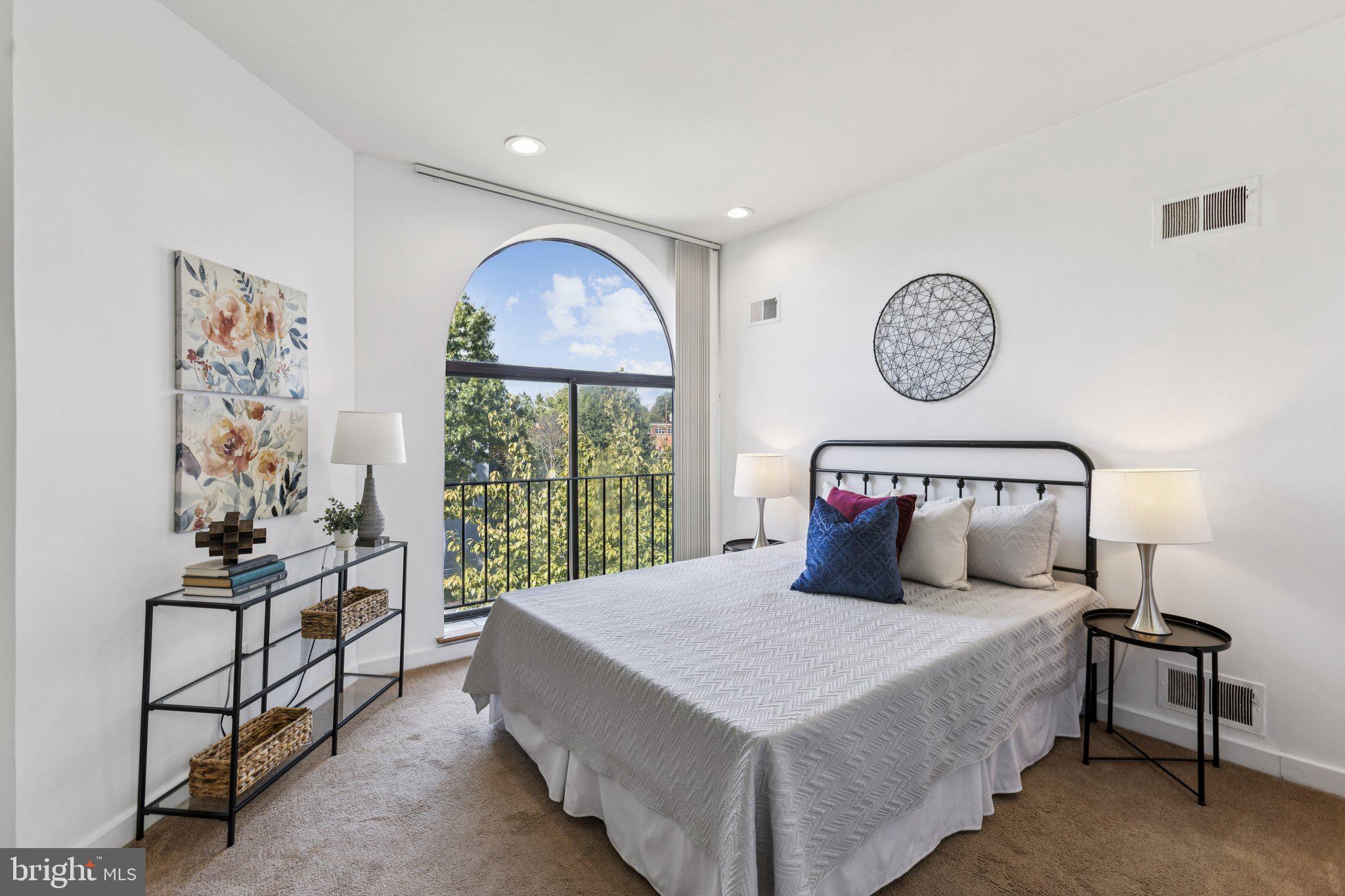 406 15th Street Southeast Washington, DC 20003 - Photo 14 of 39 a bedroom with a bed and a window