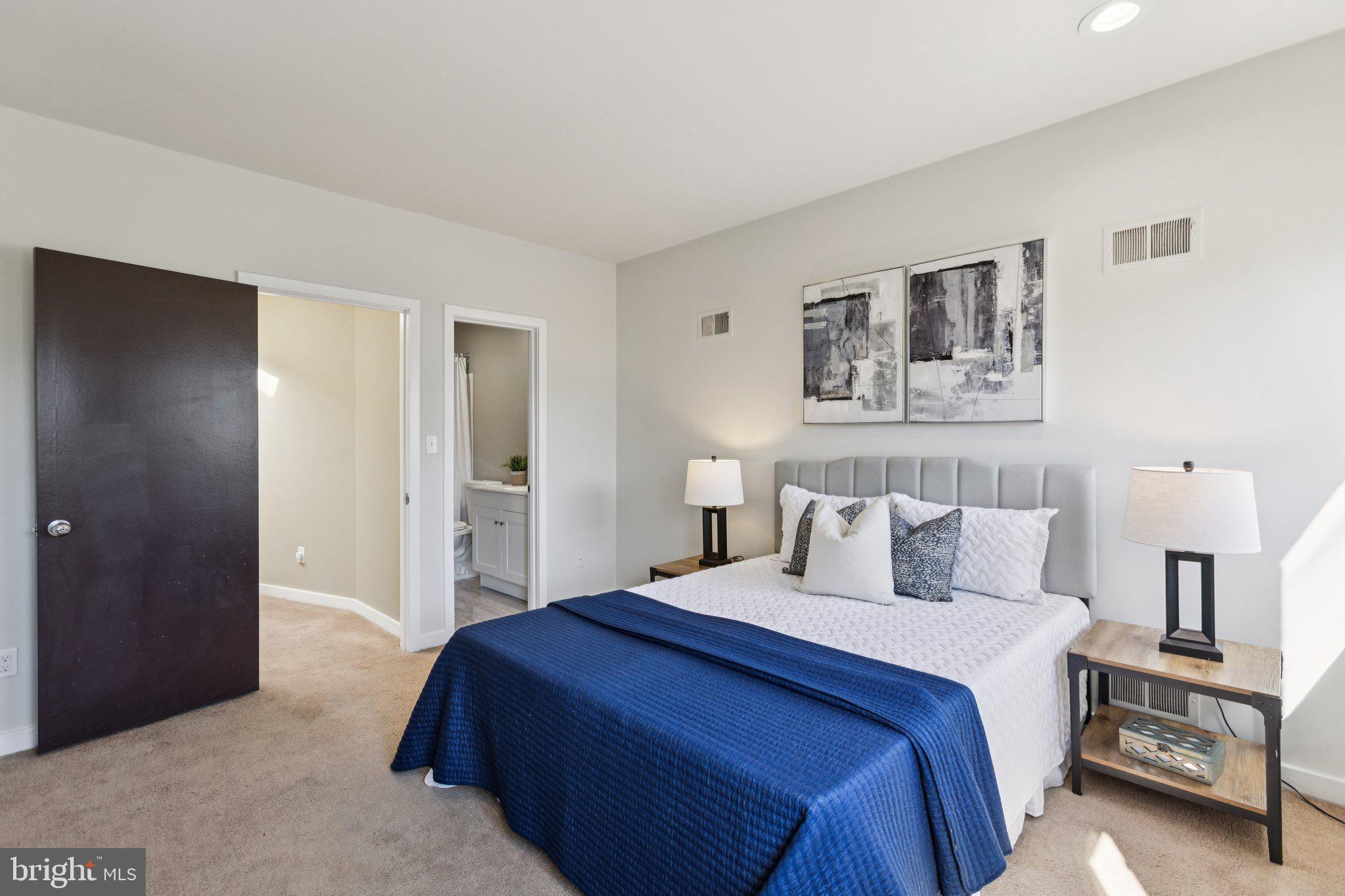 406 15th Street Southeast Washington, DC 20003 - Photo 18 of 39 a bedroom with a bed and a lamp