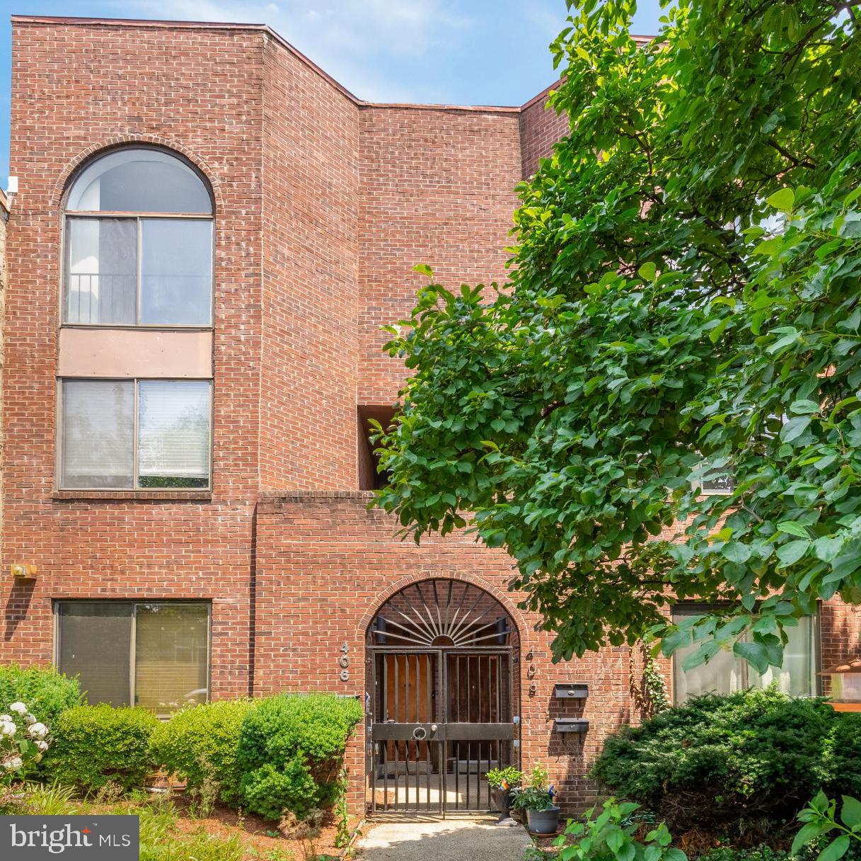 406 15th Street Southeast Washington, DC 20003 - Photo 2 of 39 a front view of a house with a garden