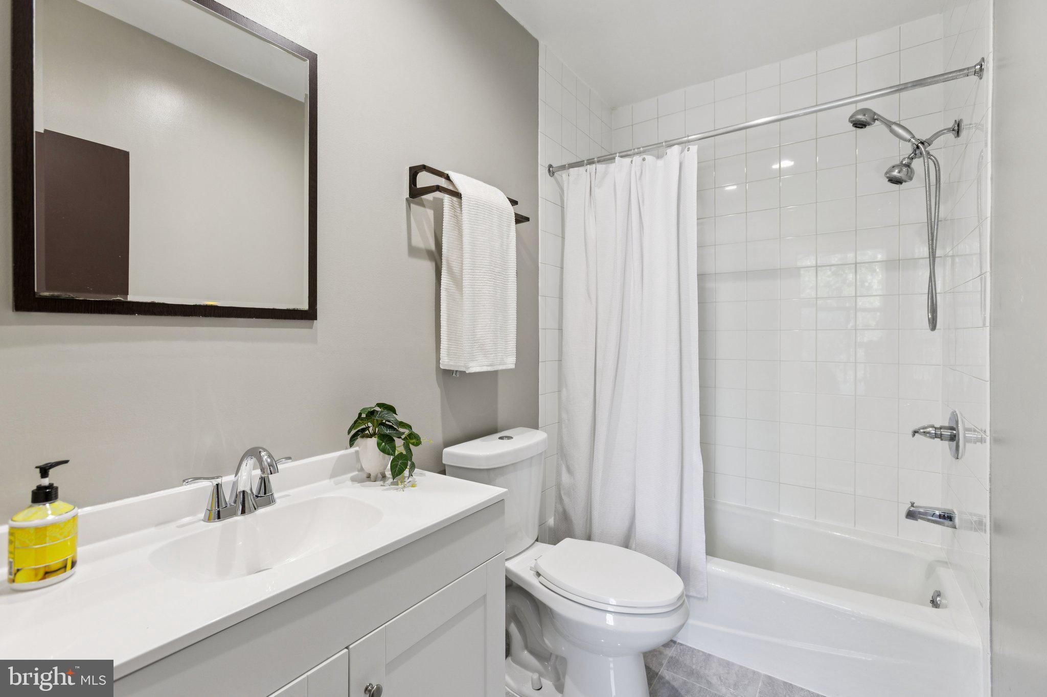 406 15th Street Southeast Washington, DC 20003 - Photo 22 of 39 a bathroom with a sink toilet and shower
