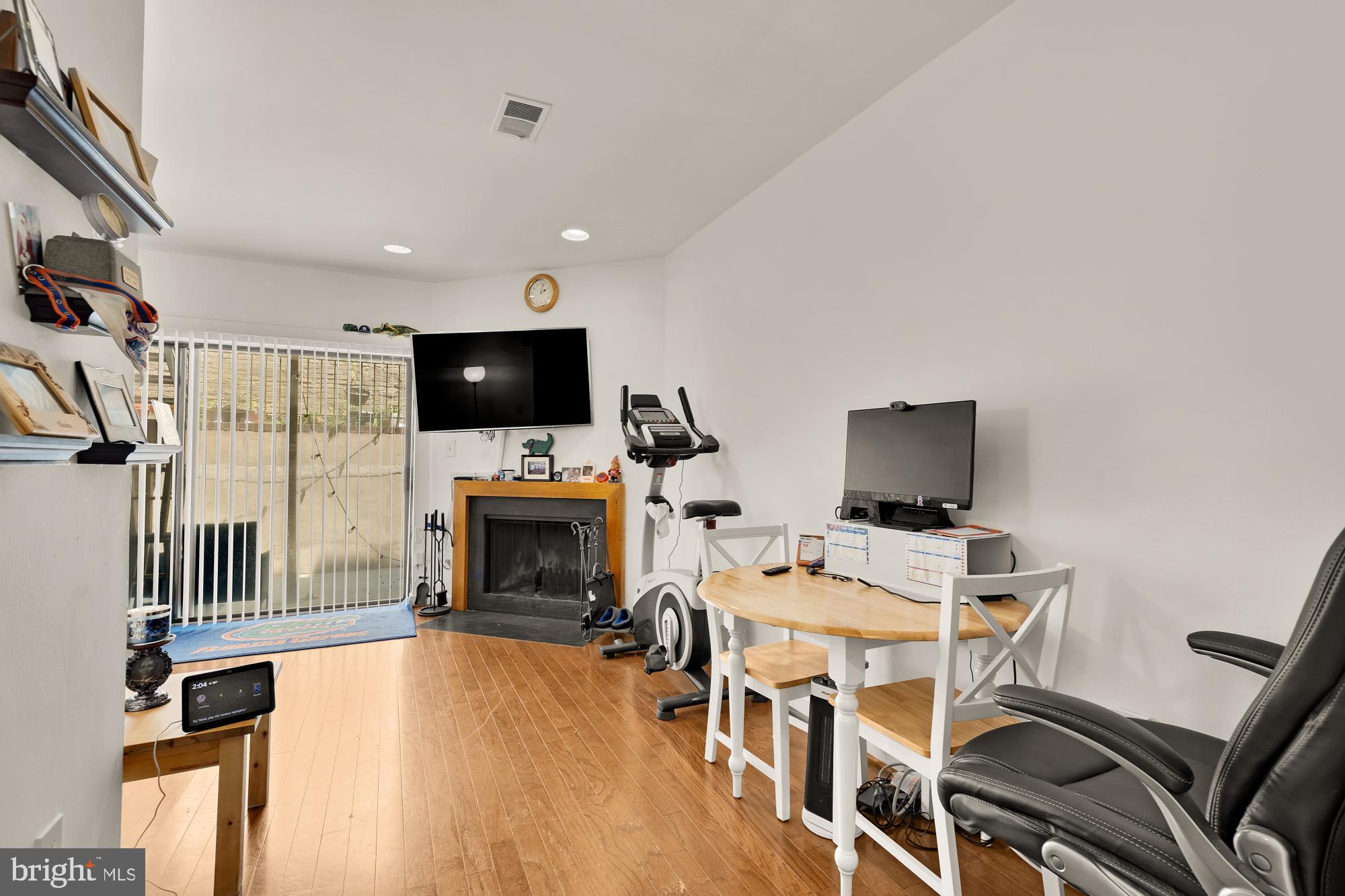 406 15th Street Southeast Washington, DC 20003 - Photo 24 of 39 a living room with furniture a flat screen tv and a fireplace
