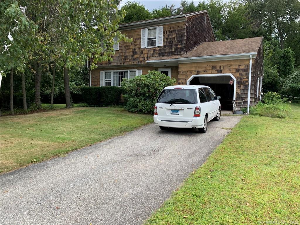 50 Grassland Road Milford, CT 06461 - Photo 1 of 1 a car parked in front of a house