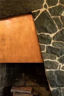 a living room with furniture and large windows