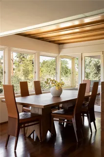 a sink with a window and wooden floor