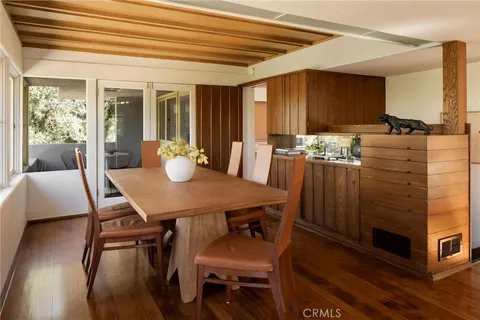 a view of balcony with furniture and wooden floor