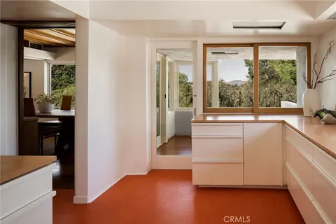 a view of living room with furniture and a window
