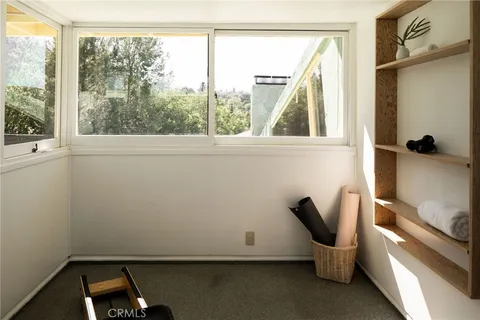 a room with furniture and air hockey table