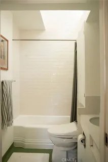 a front view of a house with yard and green space