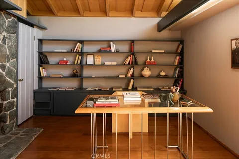 a view of a patio with table and chairs and potted plants