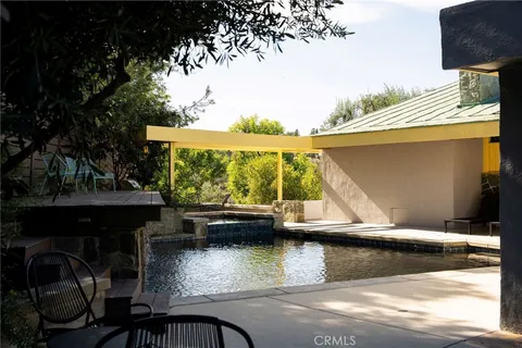 a view of a swimming pool with an outdoor space