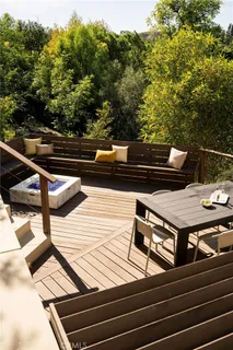 a couple of table and chairs in front of house