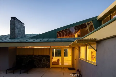 a view of a swimming pool with an outdoor space and seating area
