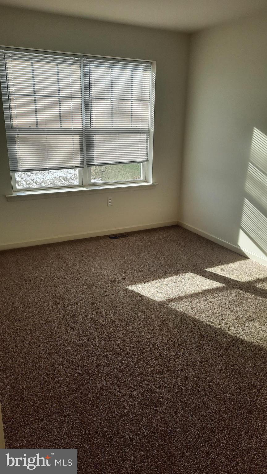 815 Schooner Lane Mechanicsburg, PA 17050 - Photo 11 of 15 a view of an empty room with a window