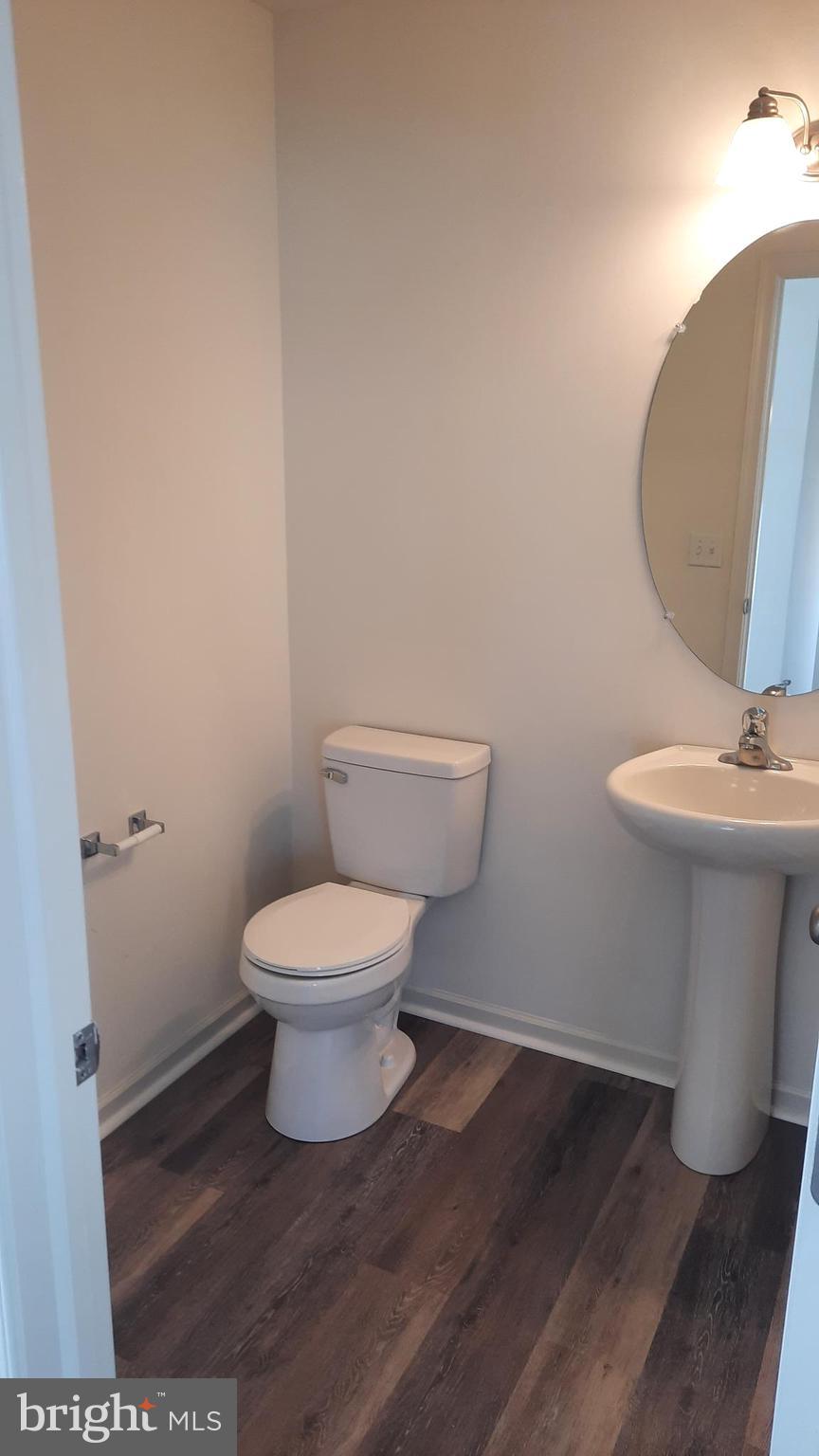 815 Schooner Lane Mechanicsburg, PA 17050 - Photo 7 of 15 a white toilet sitting next to a bathroom sink