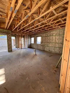 a view of a room with wooden walls