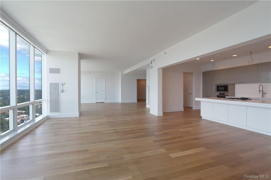 1 Renaissance Square, Unit PH40C White Plains, NY 10601 - Photo 5 of 14 a view of a kitchen with a sink and a large window