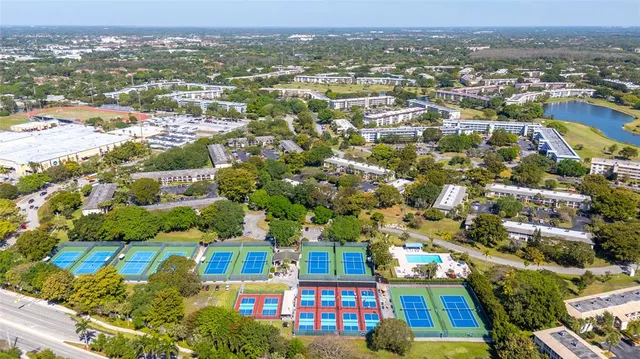 an aerial view of residential houses with city view