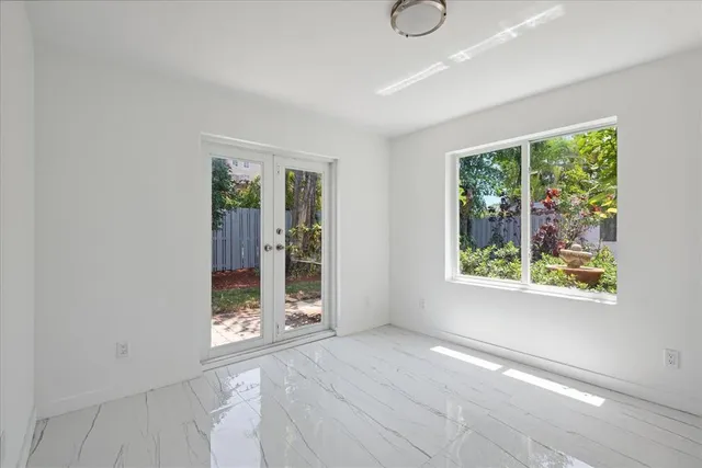 a view of an empty room with a window