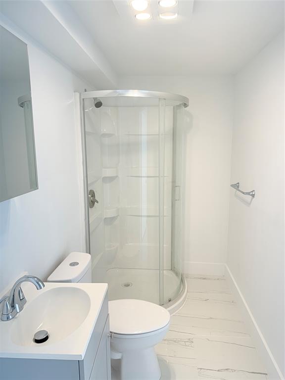 2201-1 Northeast 9th Avenue, Unit 1 Wilton Manors, FL 33305 - Photo 19 of 21 a bathroom with a sink a toilet and shower