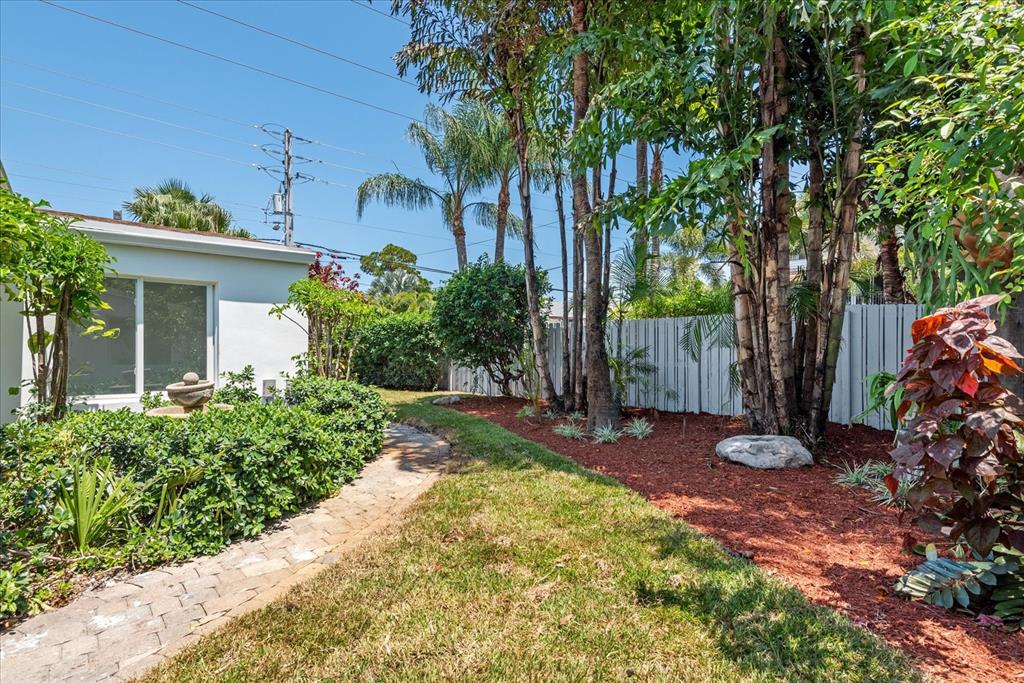 2201-1 Northeast 9th Avenue, Unit 1 Wilton Manors, FL 33305 - Photo 20 of 21 front view of a house with a garden