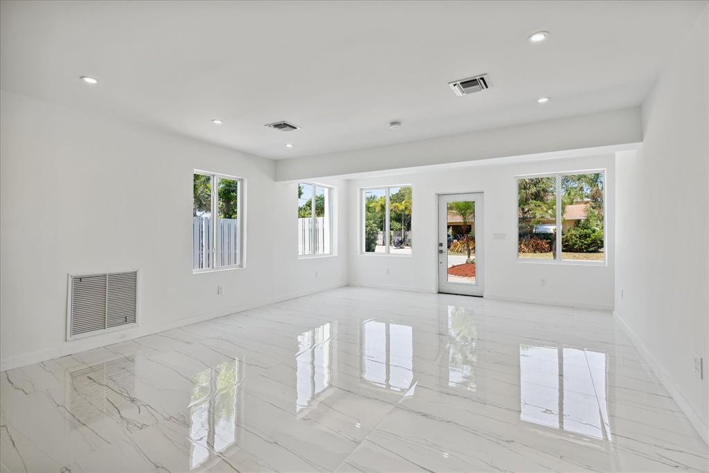 2201-1 Northeast 9th Avenue, Unit 1 Wilton Manors, FL 33305 - Photo 4 of 21 a view of an empty room with a window