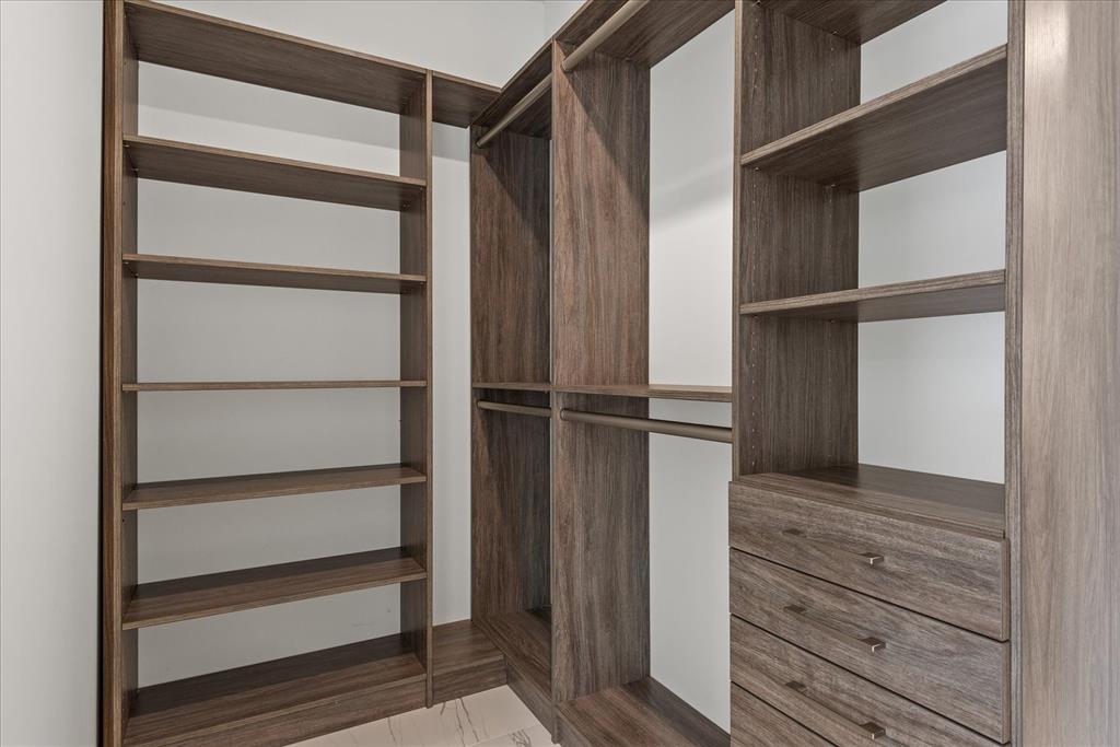 2201-1 Northeast 9th Avenue, Unit 1 Wilton Manors, FL 33305 - Photo 9 of 21 a view of walk in closet with empty racks