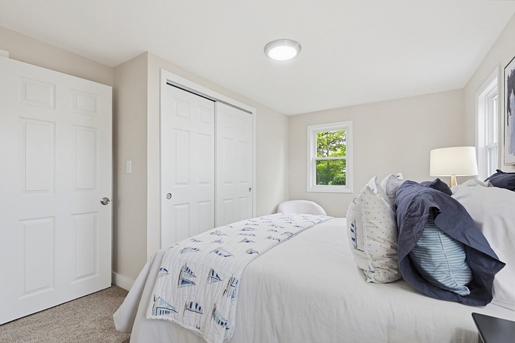 24 Otis Road Barnstable, MA 02601 - Photo 11 of 33 a bedroom with a bed and a window
