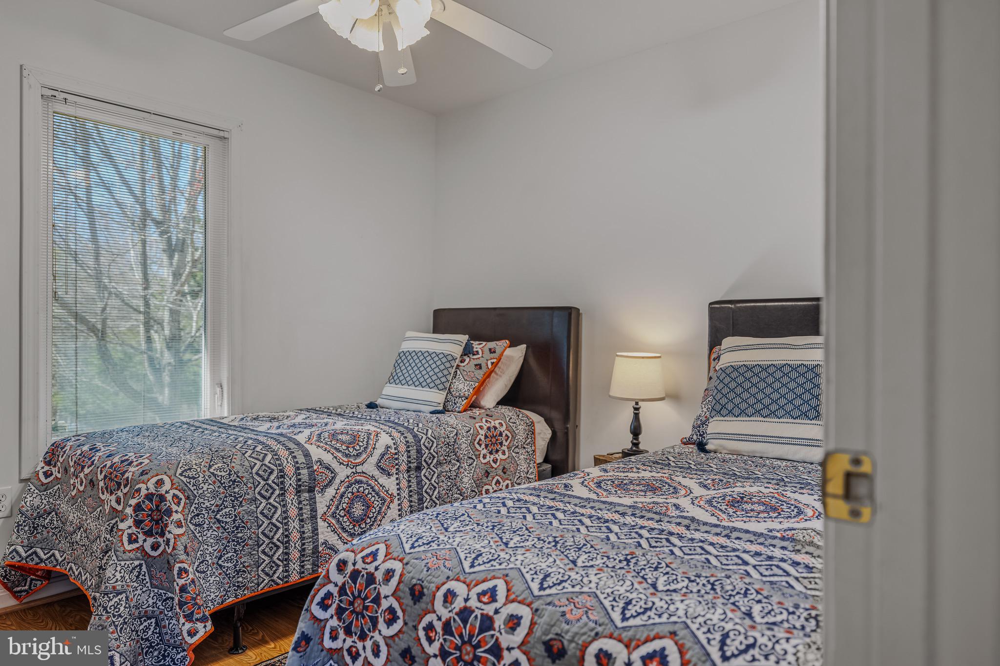 72 Medfords Lane Berkeley Springs, WV 25411 - Photo 19 of 52 a bedroom with two beds and a lamp