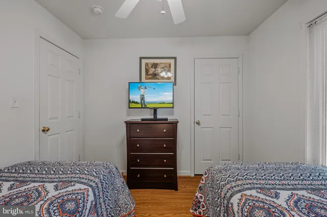 a bedroom with a bed and a dresser
