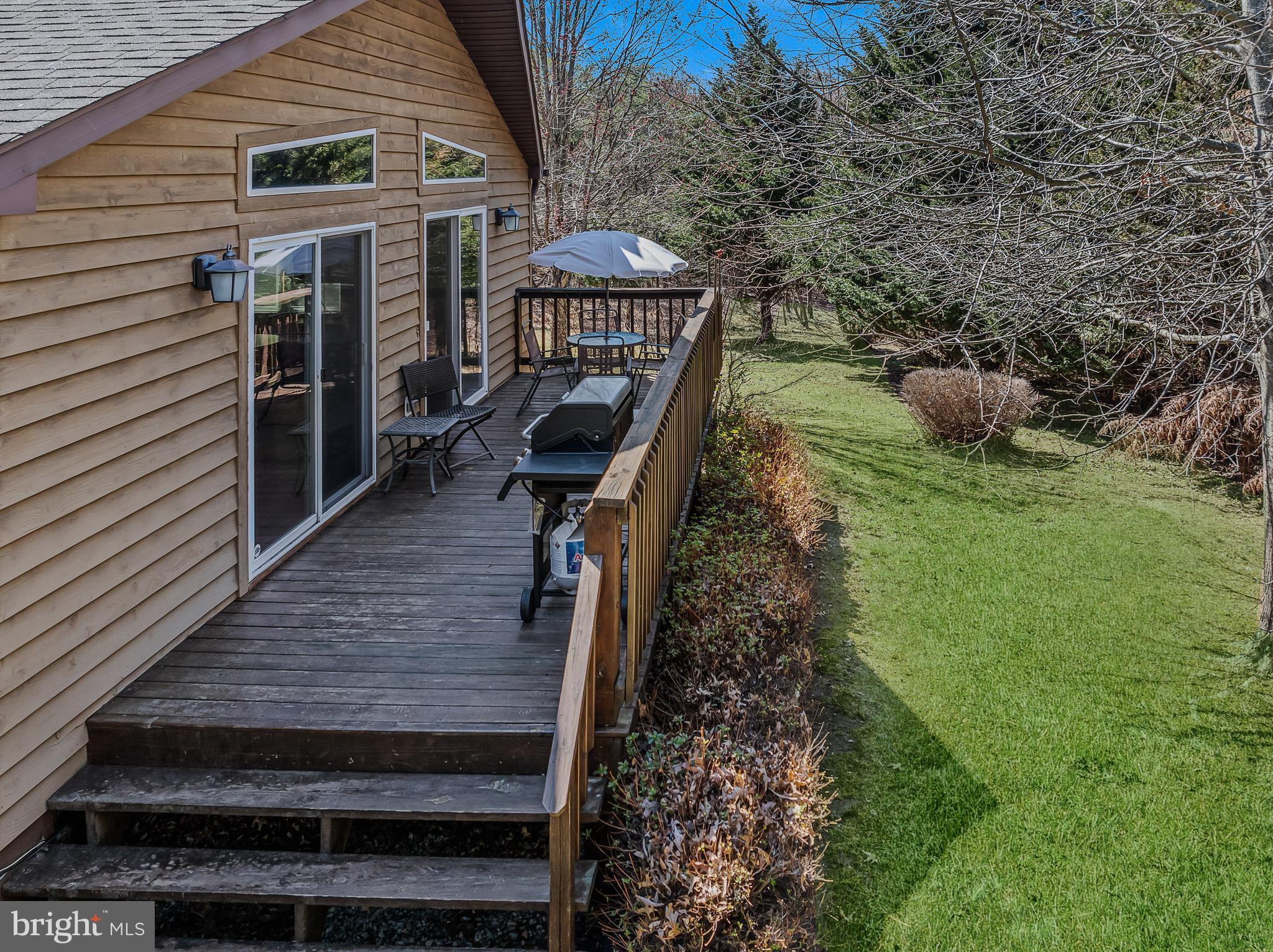 72 Medfords Lane Berkeley Springs, WV 25411 - Photo 33 of 52 a view of a deck with wooden floor and fence