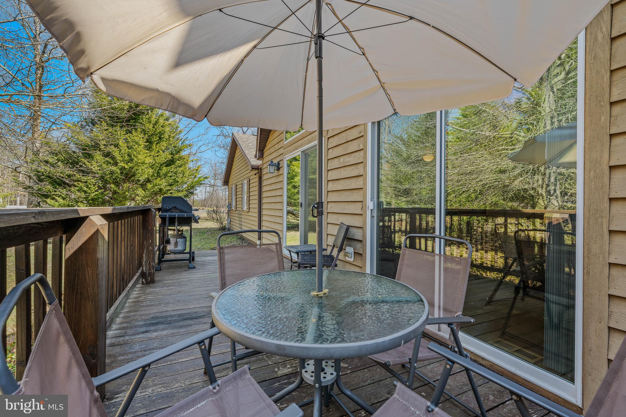 72 Medfords Lane Berkeley Springs, WV 25411 - Photo 35 of 52 a patio with glass top table and chairs