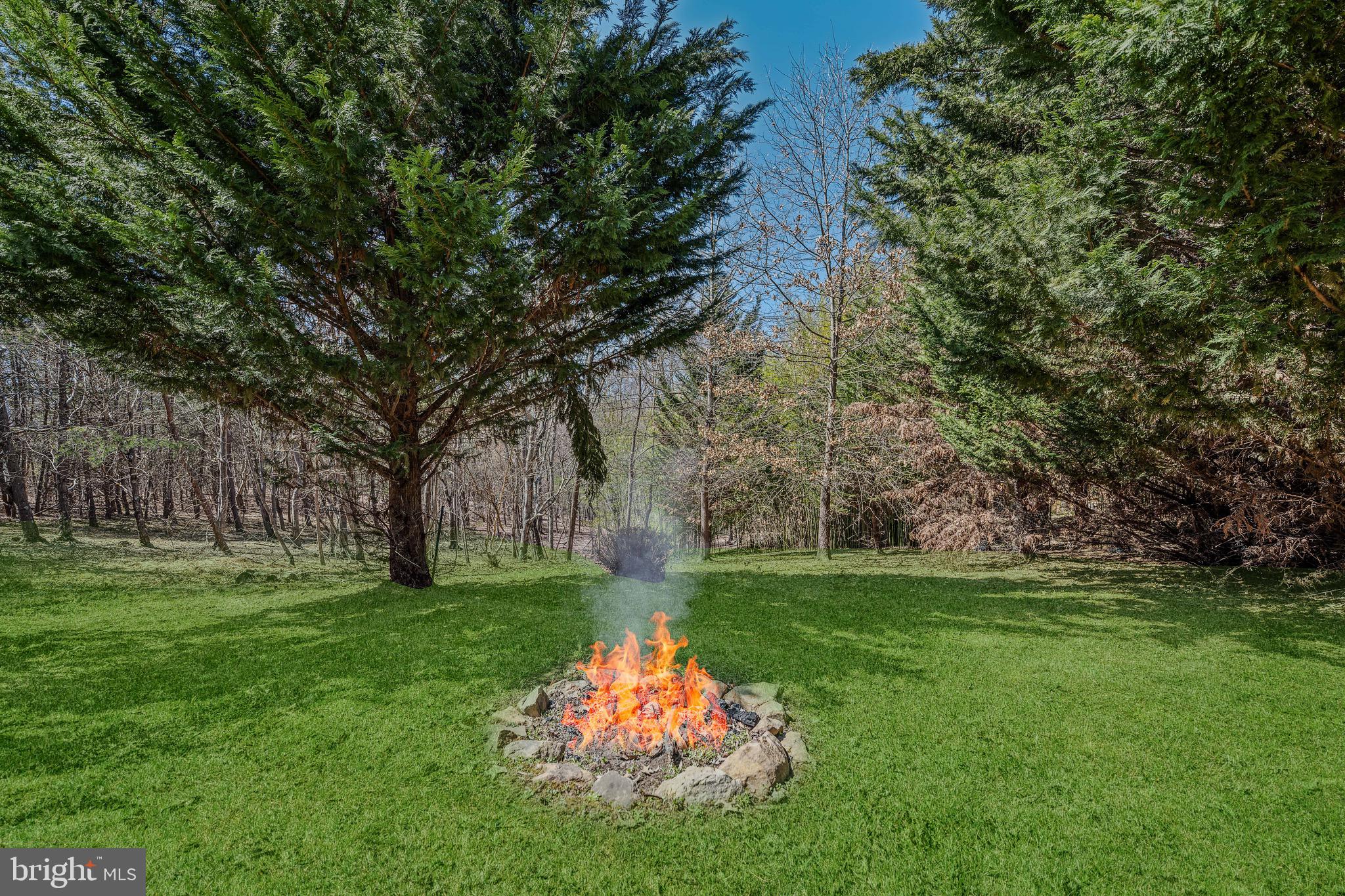 72 Medfords Lane Berkeley Springs, WV 25411 - Photo 37 of 52 a backyard of a house with seating space