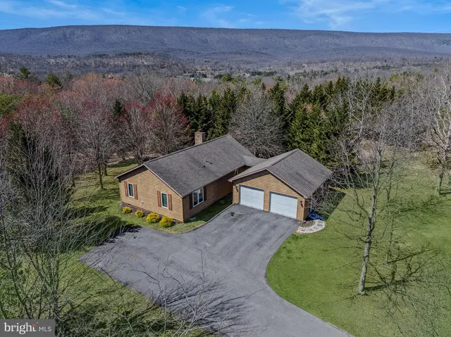 an aerial view of a house with a garden