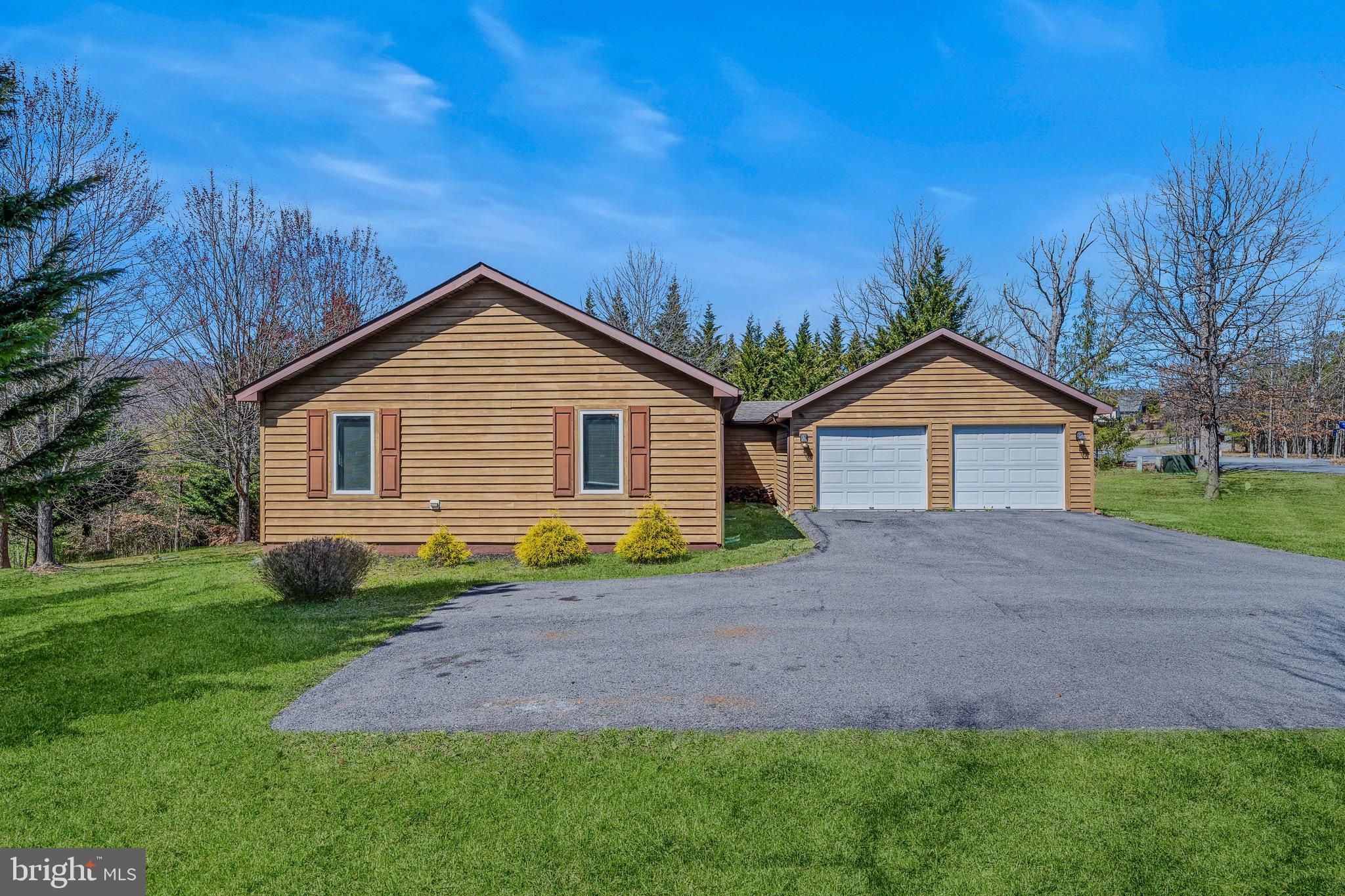 72 Medfords Lane Berkeley Springs, WV 25411 - Photo 40 of 52 a front view of a house with garden