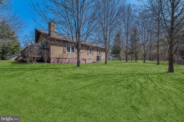 a view of a house with a big yard