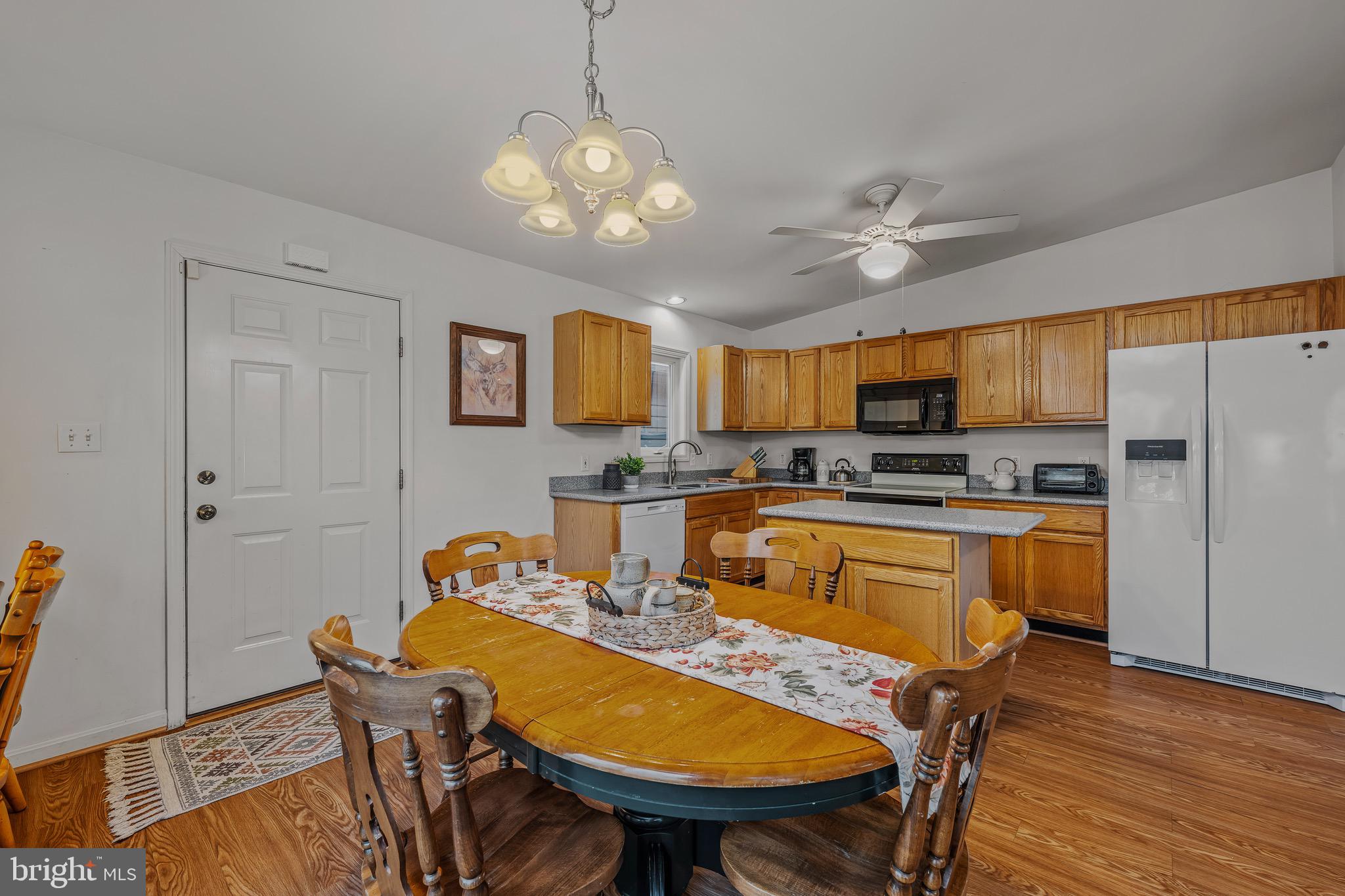 72 Medfords Lane Berkeley Springs, WV 25411 - Photo 7 of 52 a view of kitchen with sink refrigerator dining table and chairs